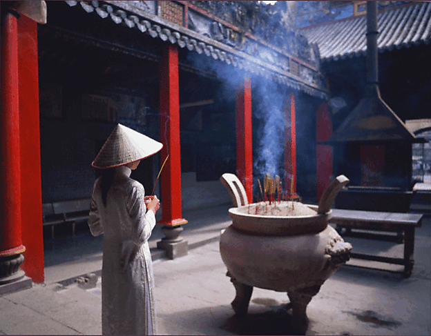 woman-in-conical-hat-burnin